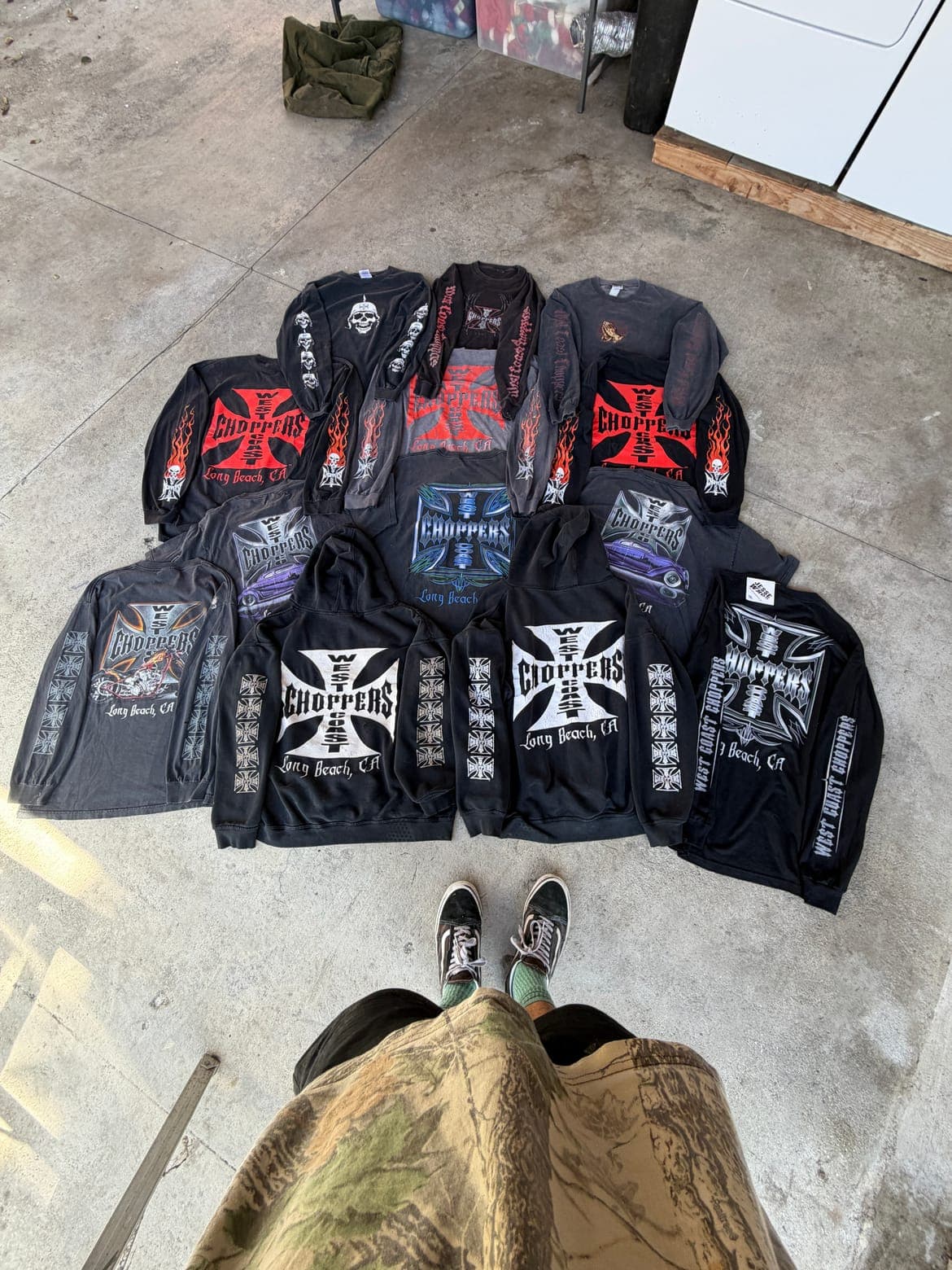 A vintage apparel drop laid out on the floor, previewed with Yanni